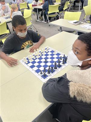 2 SWA student playing chess